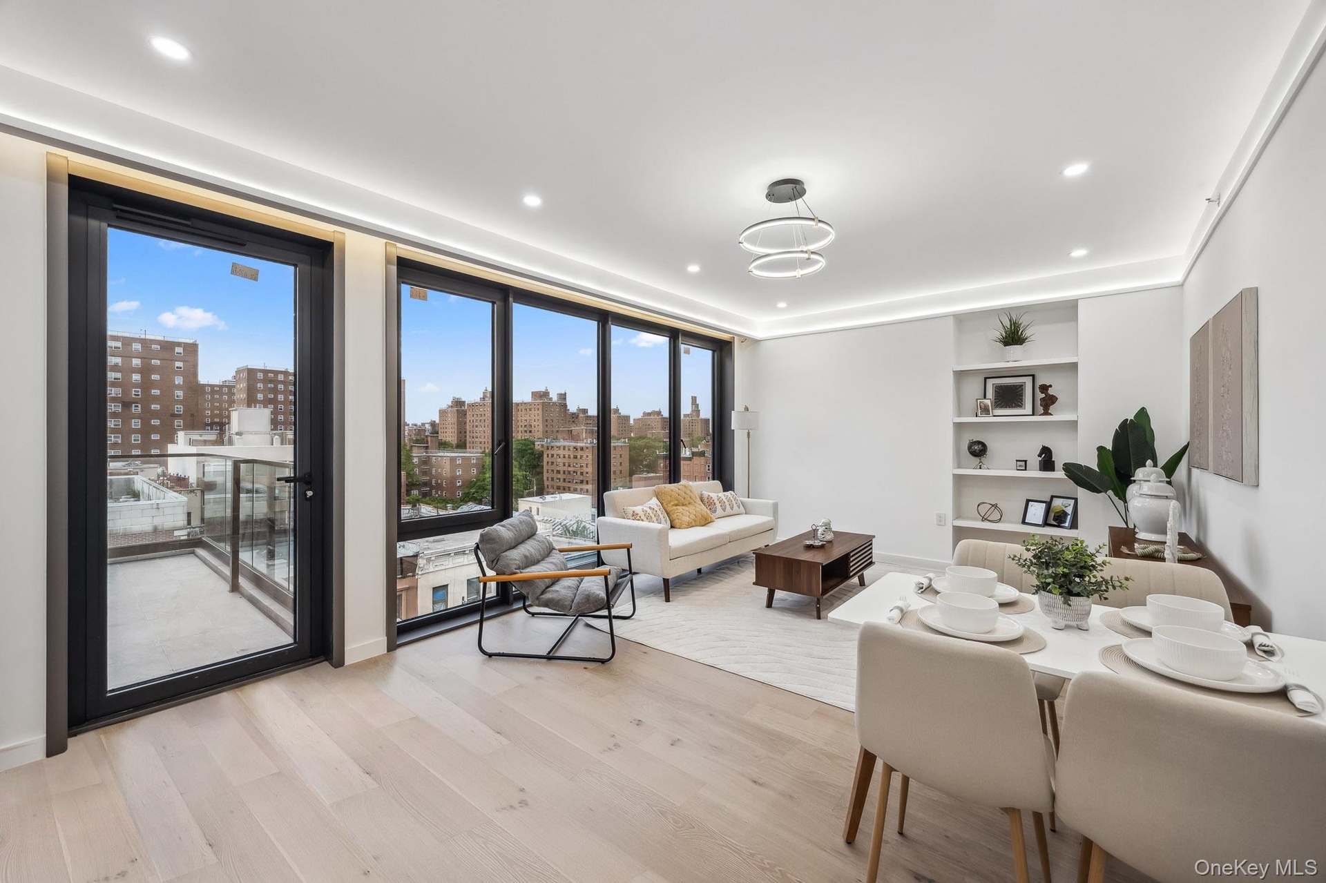 Living room featuring light wood finished floors, a view of city, and recessed lighting