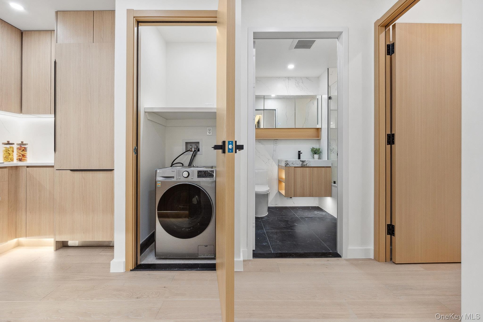 Laundry room featuring washer / dryer and baseboards
