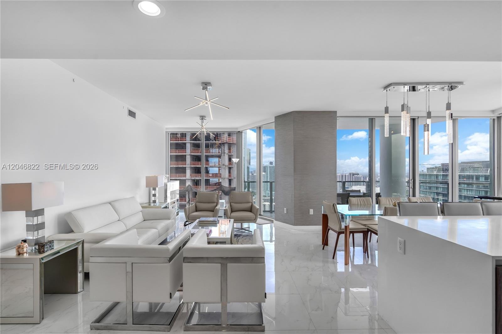 Waterfall quartz island with integrated sink and built-in Miele oven
