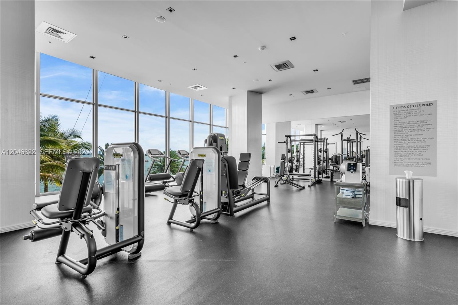 Fitness center with modern equipment and bay views
