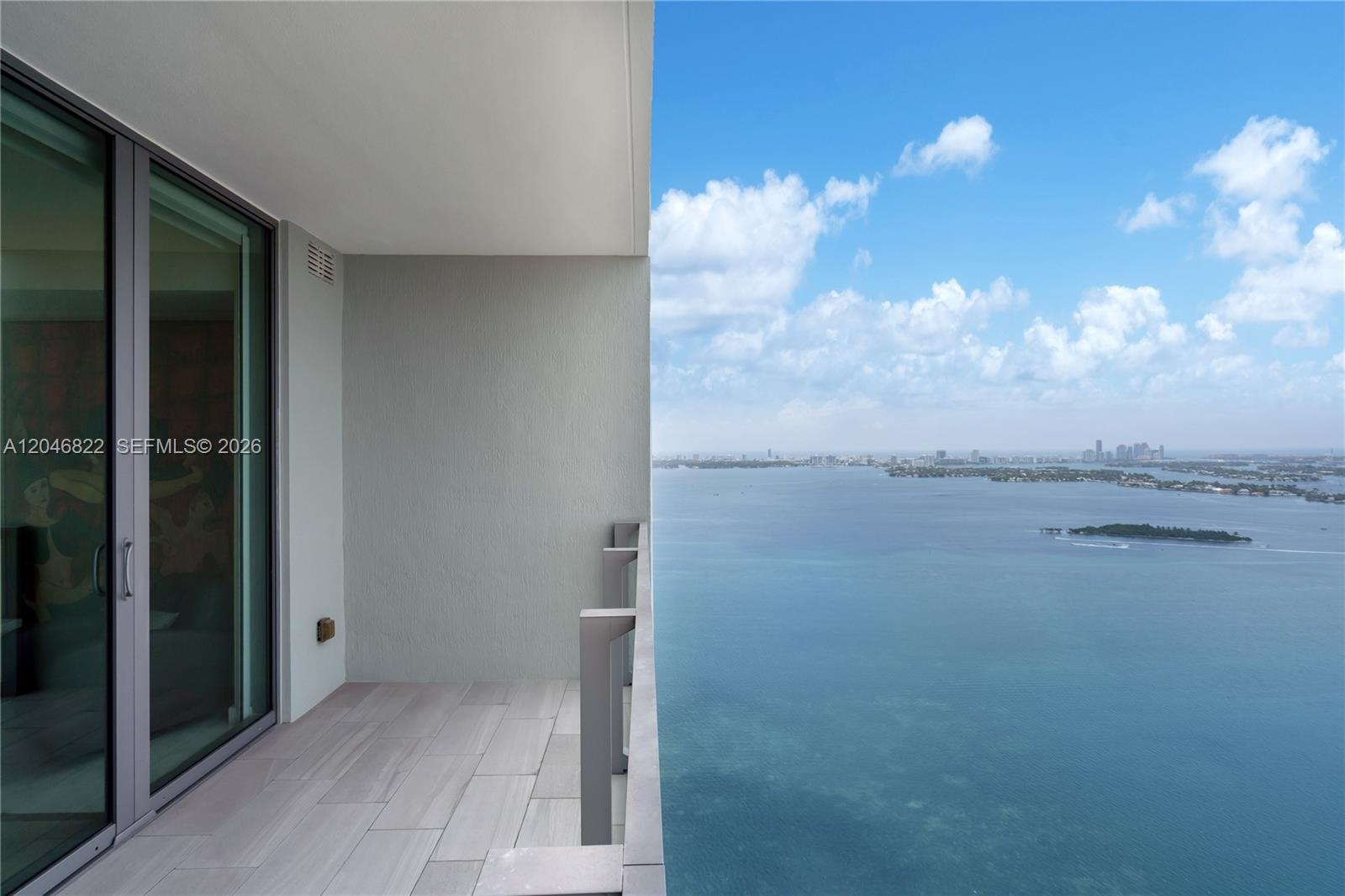 Terrace lounge overlooking the Edgewater waterfront and skyline
