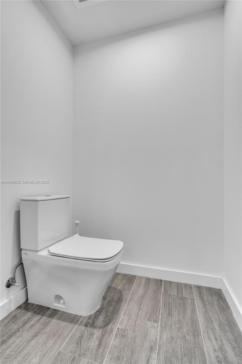 Custom walk-in closet with built-in shelving and drawers