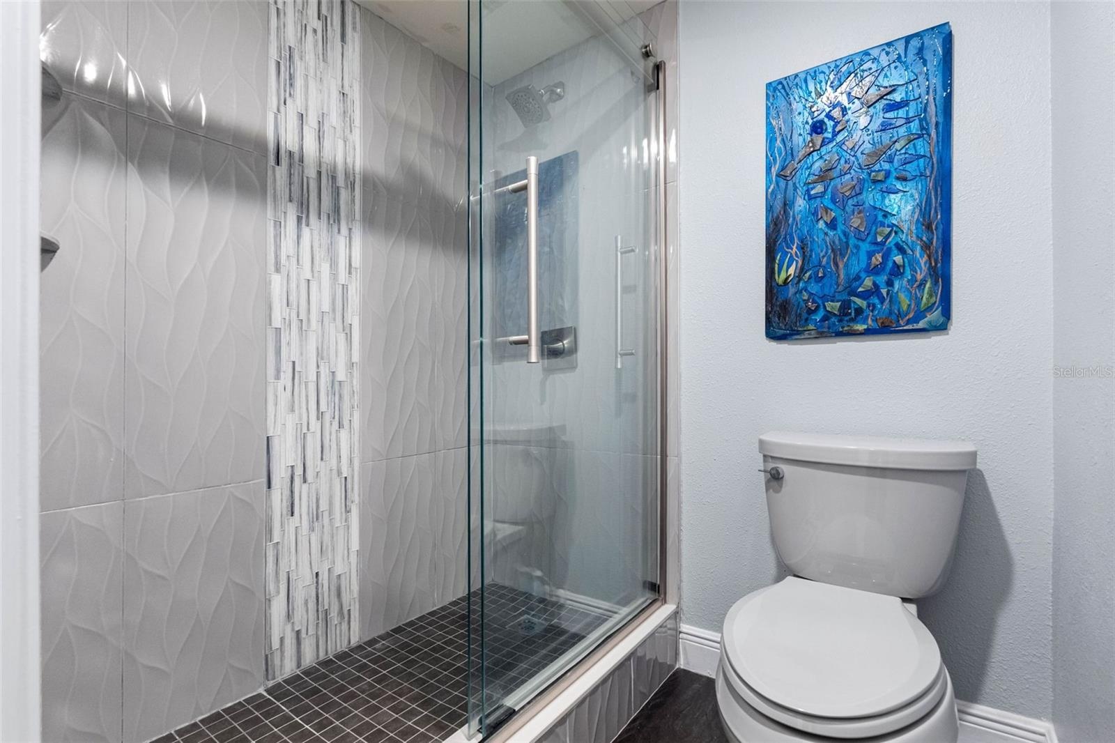 Full Bath on Main Level  Between Kitchen Area and 2nd Guest Bedroom. All 3 Bathrooms Have Been Remodeled.