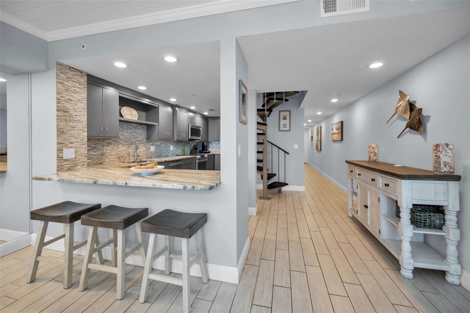 ...Remodeled Kitchen - Good Open Design For Entertaining and Enjoying the Florida Beach Front Lifestyle.