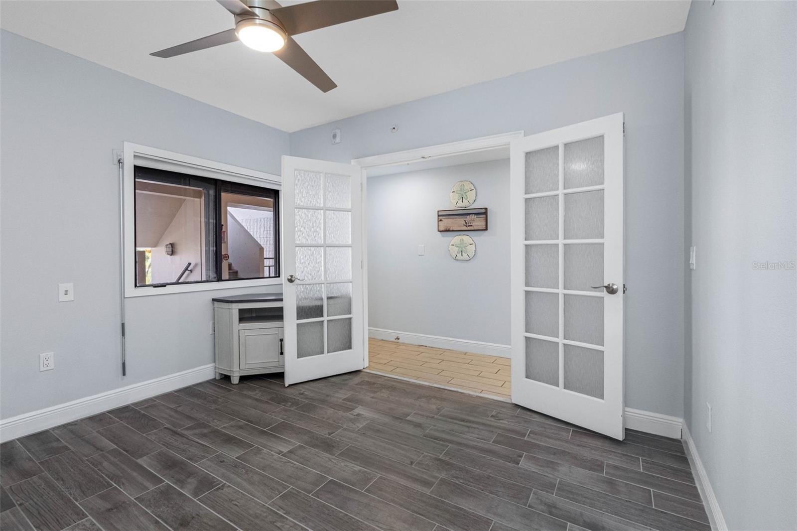 .. Guest Bedroom #2 Located on Main Level. Electric Storm Shutters - New Plank Tile Floors.