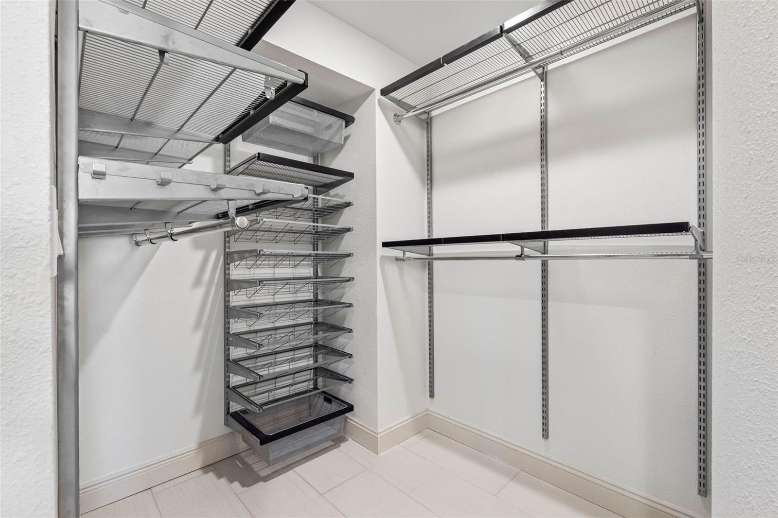..  Master  Bedroom Walk In Closet with designer built-ins including ELFA Master Closet System.