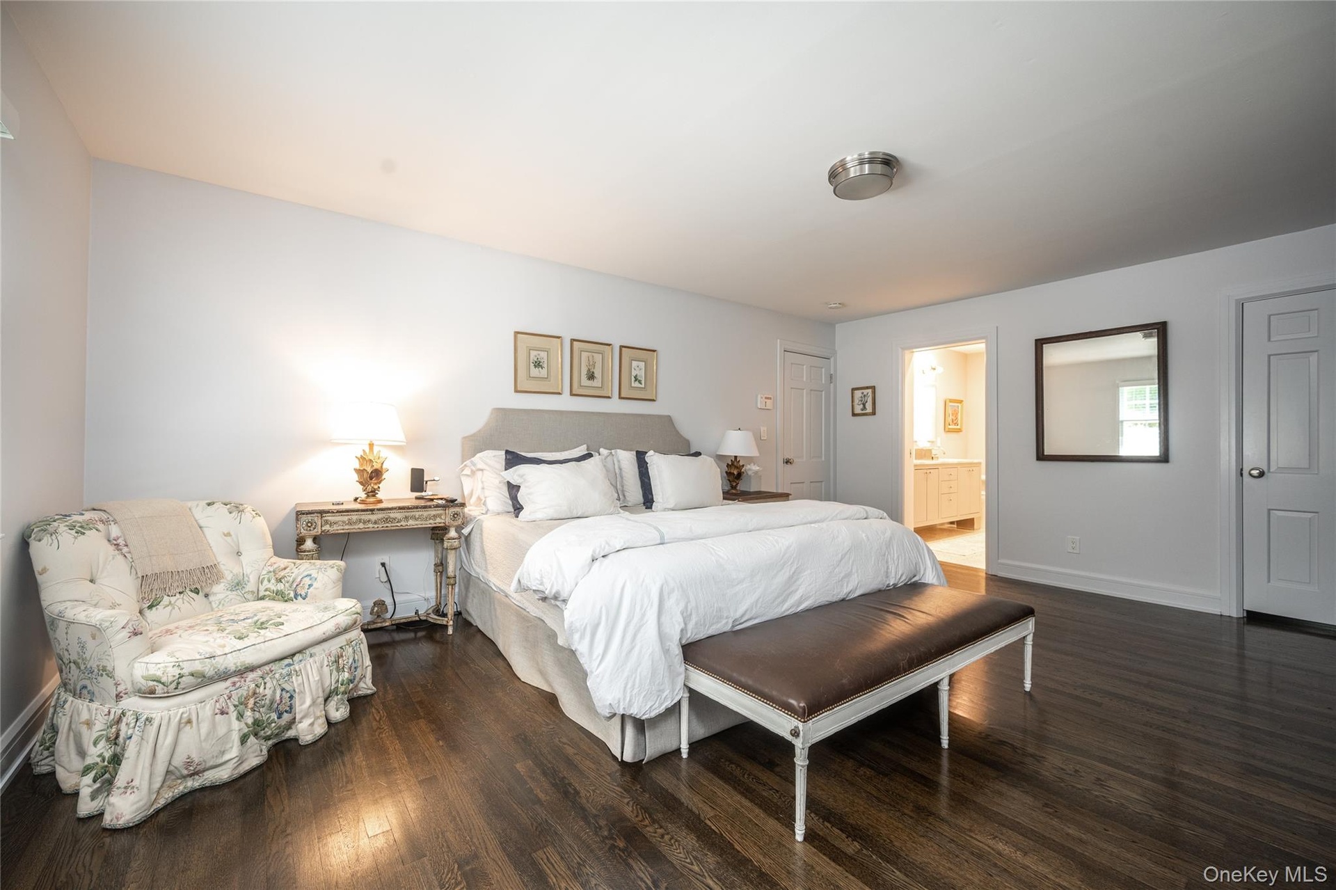 Primary Bathroom with Walk-In Closet and Pocket Door to Beautifully Renovated Bath.