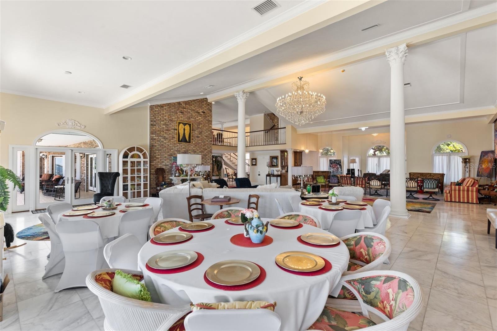 The grand Livingroom/Ballroom space overlooking a spectacular setting designed for elegant entertaining and grand-scale gatherings.