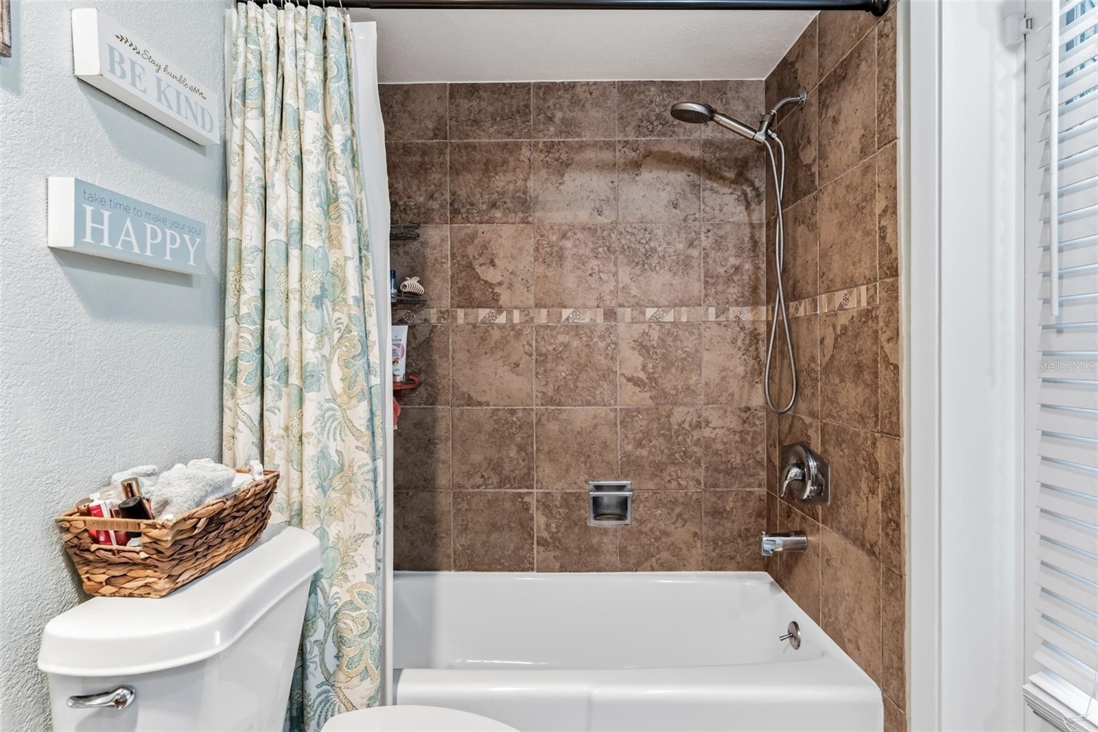 Guest bathroom has a tub/shower combo