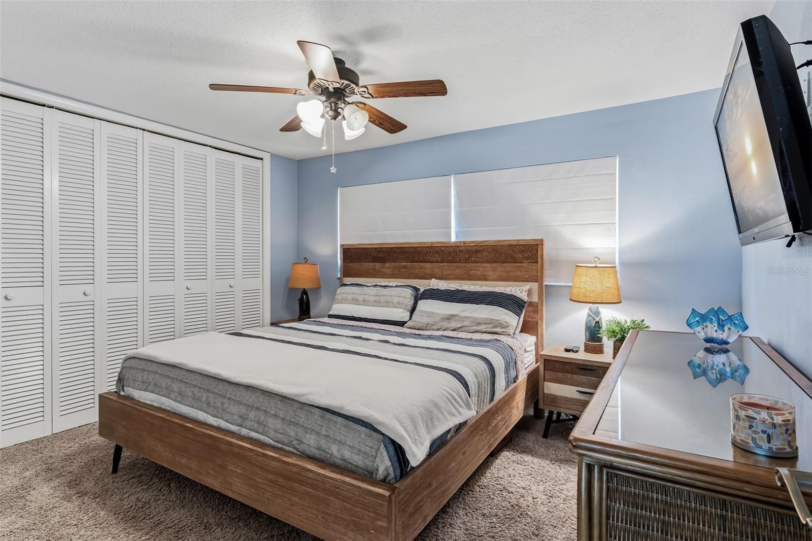 Guest bedroom #3 with a wall of closets