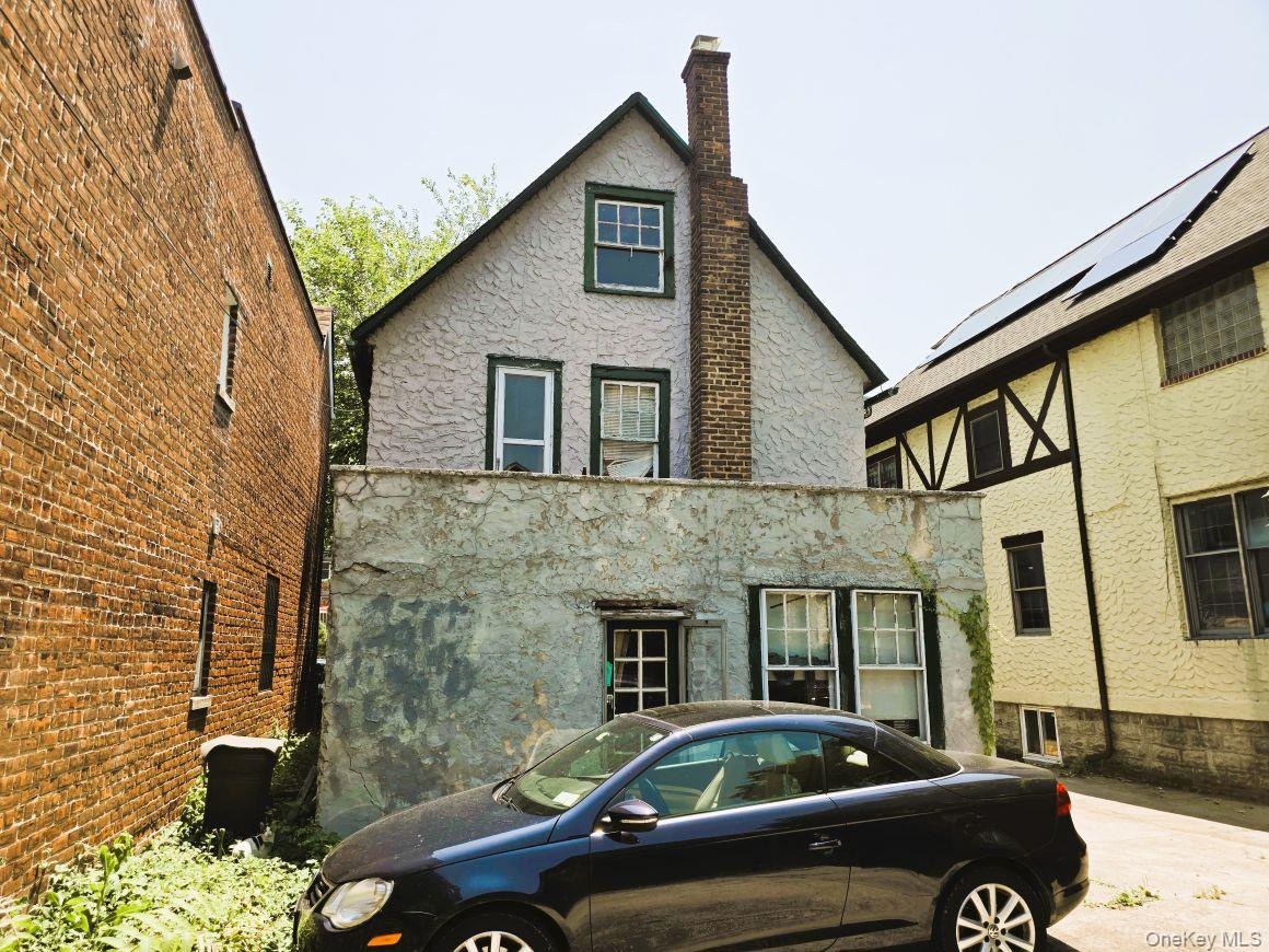 Rear of structure with door access to patio.