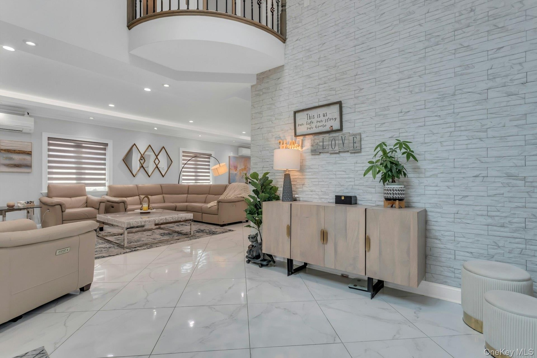 Stunning ceiling fixtures throughout with a white porcelain veined tile installed on an angle, magnifiying the length of each beautiful room