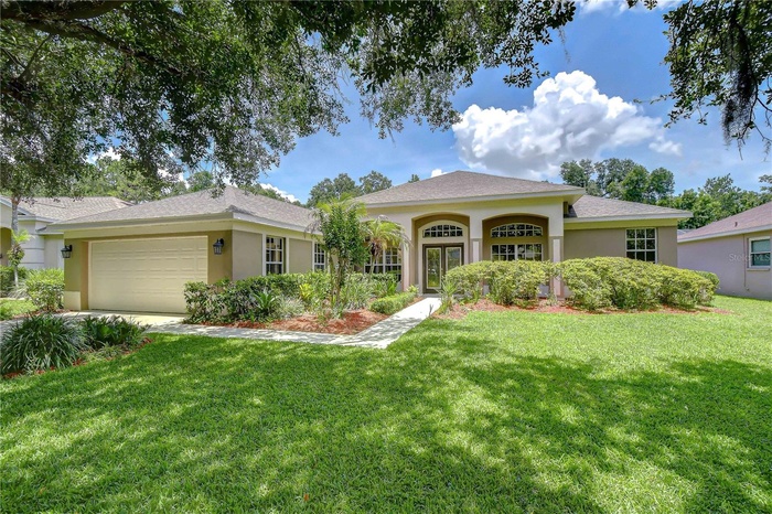 Beautiful pool home on a premium creekside homesite in River Hills Country Club.
