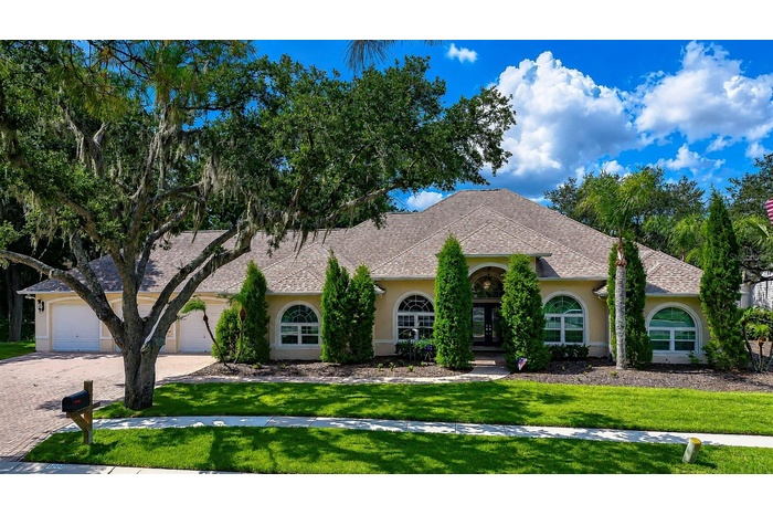 Stunning custom estate located in the exclusive Emerald Creek community.