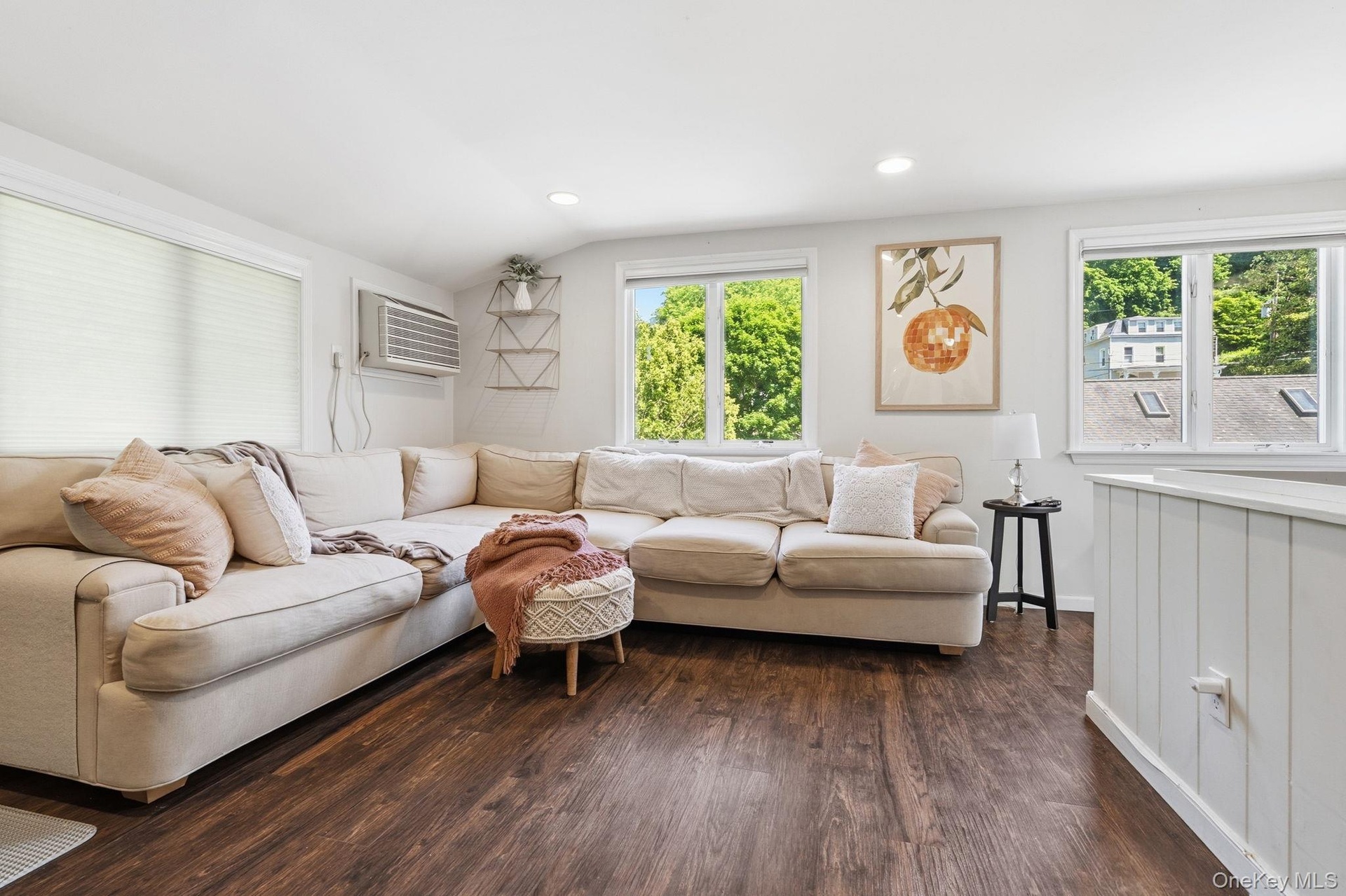 Open and versatile, this second-floor apartment living and dining space offers a clean layout and welcoming atmosphere.