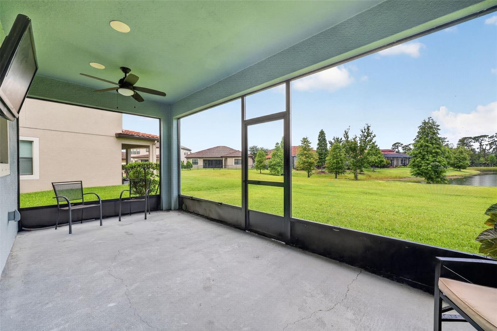 Covered and Screened Lanai with Double Ceiling Fans, Pre-Wired for Speakers and T.V. Large Screen Panels for Gorgeous View of Peaceful Natural Landsca