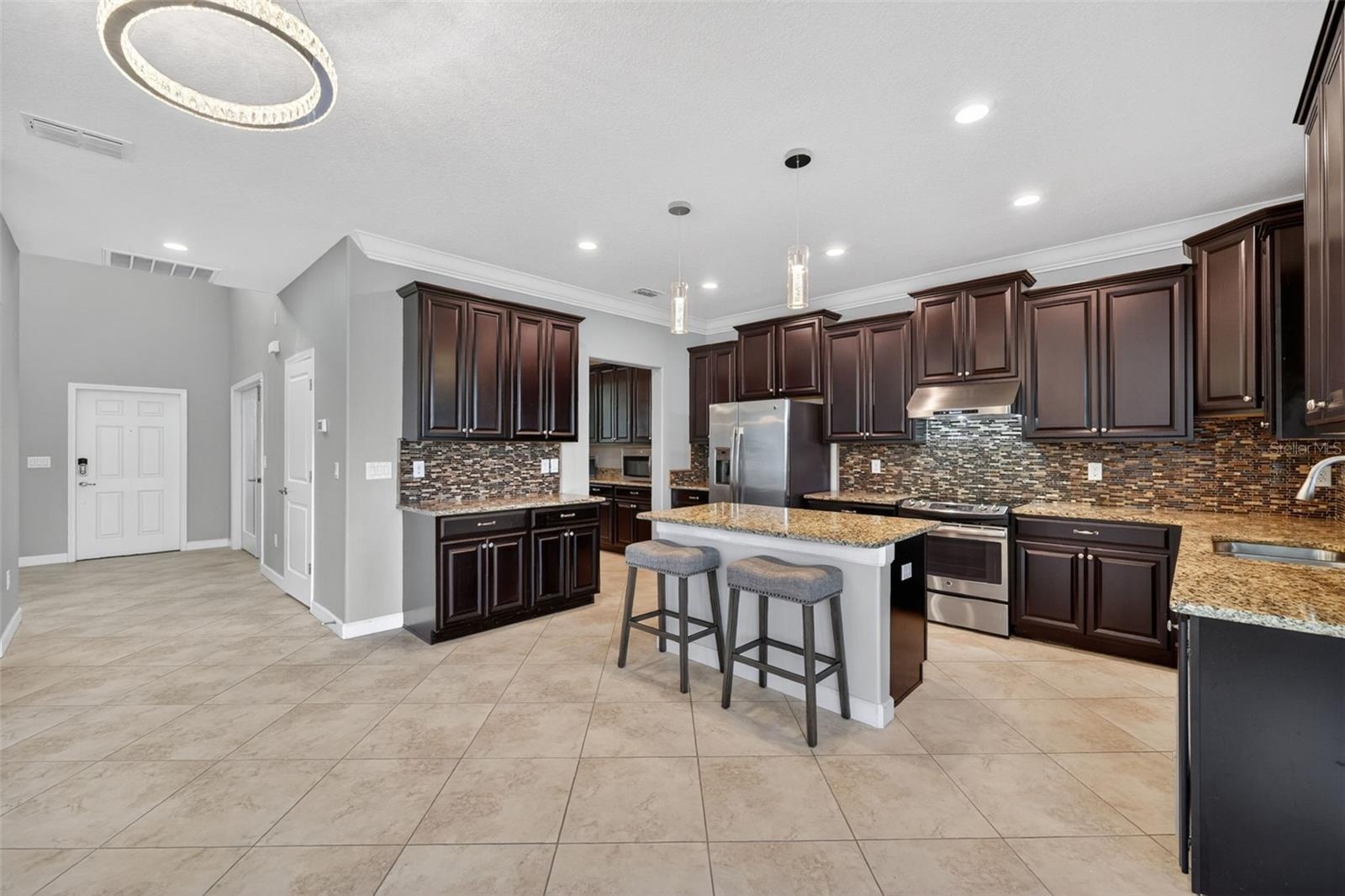 Envision a Coffee or Wine Bar - Space for it All! Full Gourmet Kitchen with Crown Molding, Island, Pendant & Recessed Lighting, Abundant Cabinets with
