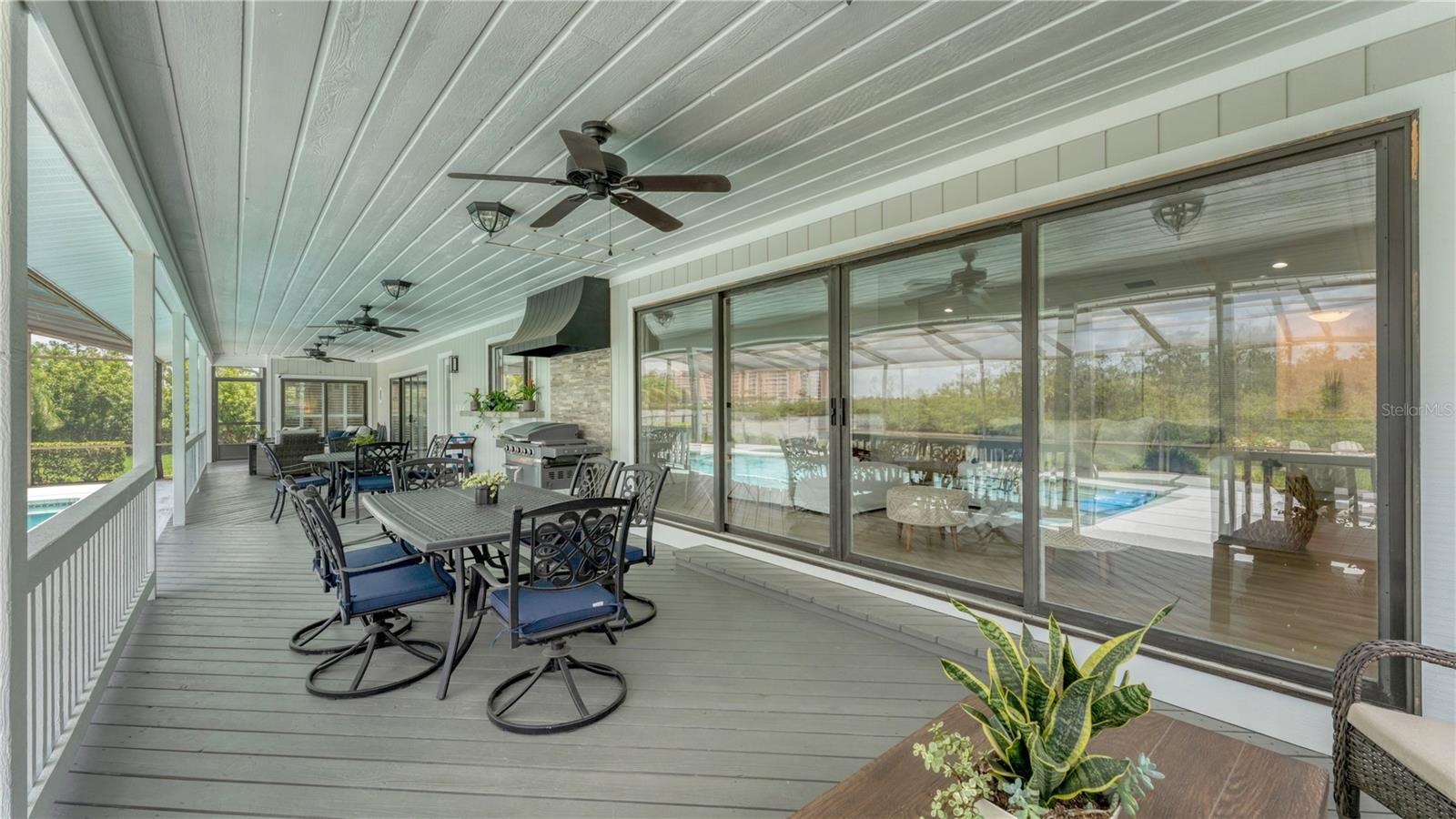 Outdoor back patio and gas grill with hood (previously staged)