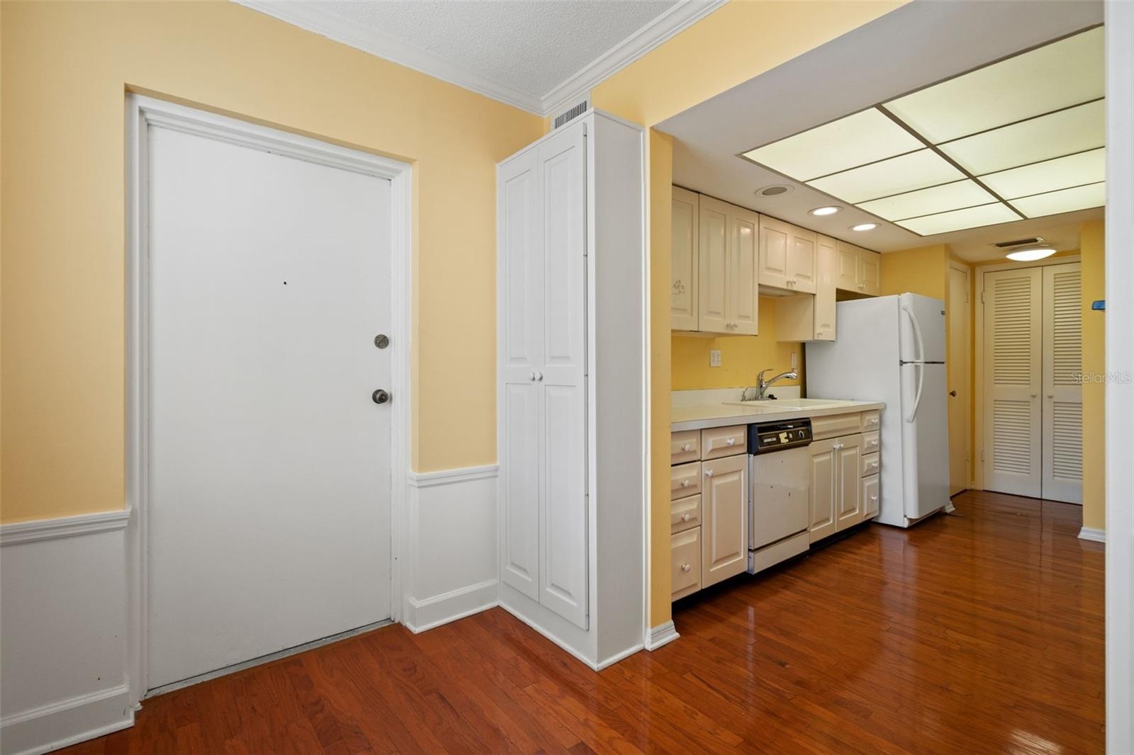Kitchen eat in space with back door leading to laundry