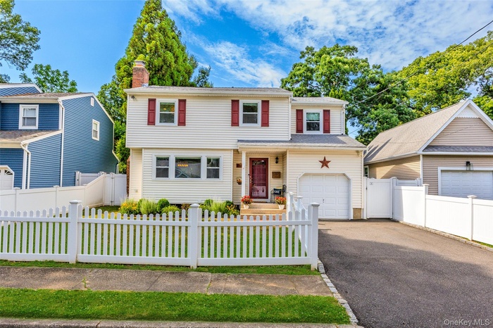 Lovelly updated 4 bedroom colonial with picket fenced front yard!