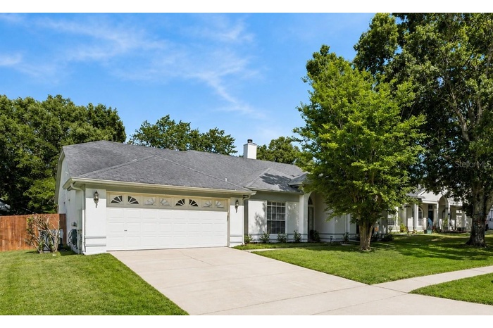Perfect Seminole County location! This charming Oviedo home features a spacious two-car garage, mature landscaping, and close proximity to top-rated s