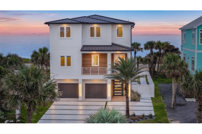 Welcome to 2214 N Central Ave, a shoreline masterpiece in the heart of Flagler Beach.