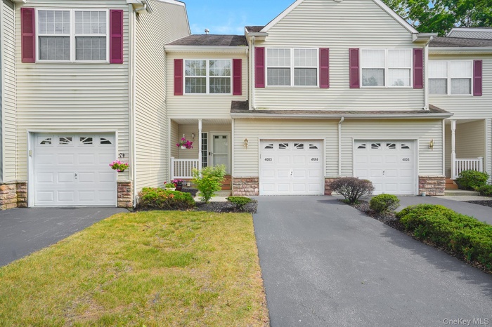 Front of unit with driveway