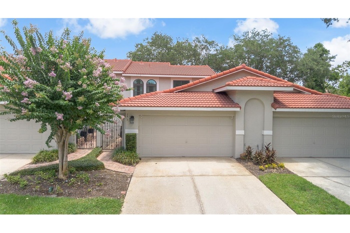 Welcome home to your completely updated and turn key Naples townhome in the gated & highly sought after Sandpointe Townhomes.