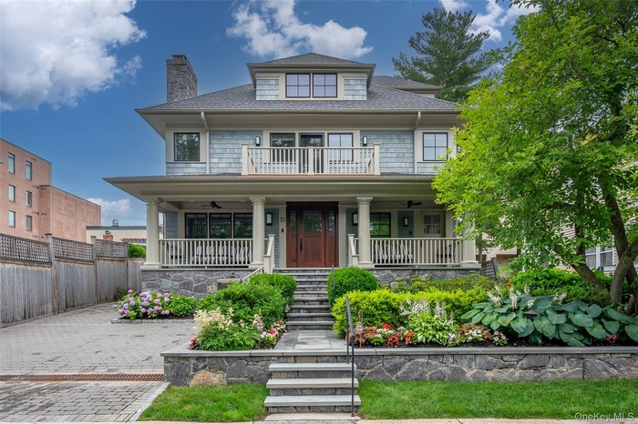 Unit is the right door. Tenant has the right side porch and the top center porch.