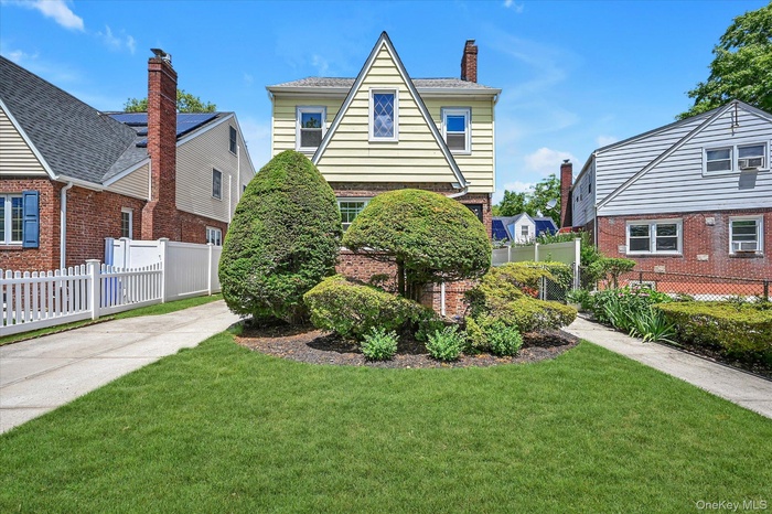 Colonial Tudor Brick & Frame