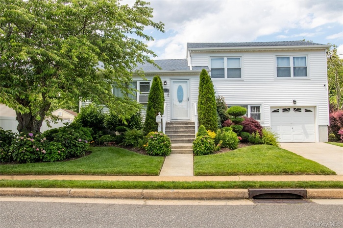 Meticuloulsly-Landscaped Front of Home with Welcoming Curb Appeal