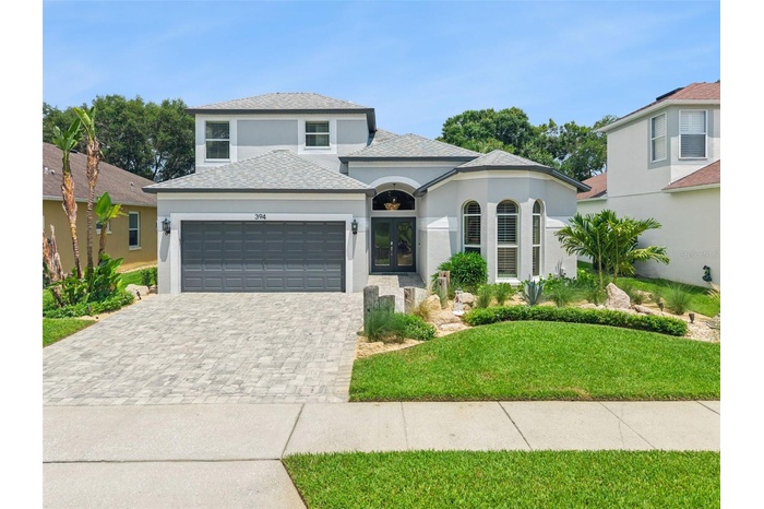 Front exposure with a gorgeous paver-driveway
