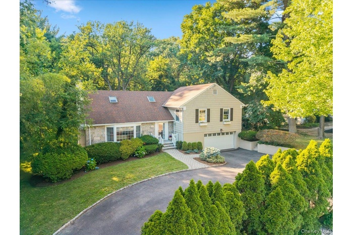 Welcome home to 372 Fort Hill Road, featuring circular driveway and beautiful landscaping