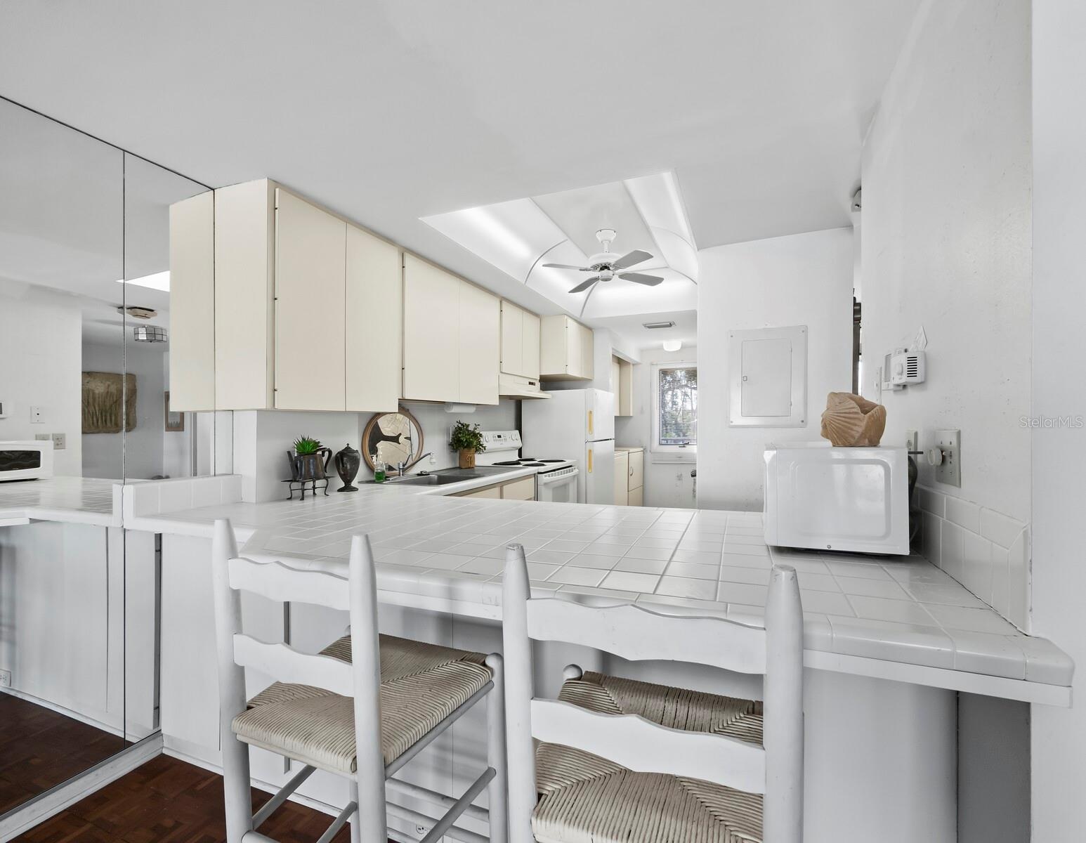A Galley style kitchen is open through the breakfast bar so you can still see that amazing view....