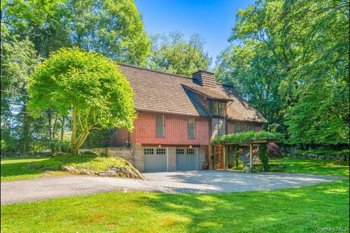 Welcome to 1821 Spring Valley Rd, a custom-built Craftsman set on 0.90 acres in the sought-after Teatown area of Croton.A Belgian block-lined driveway