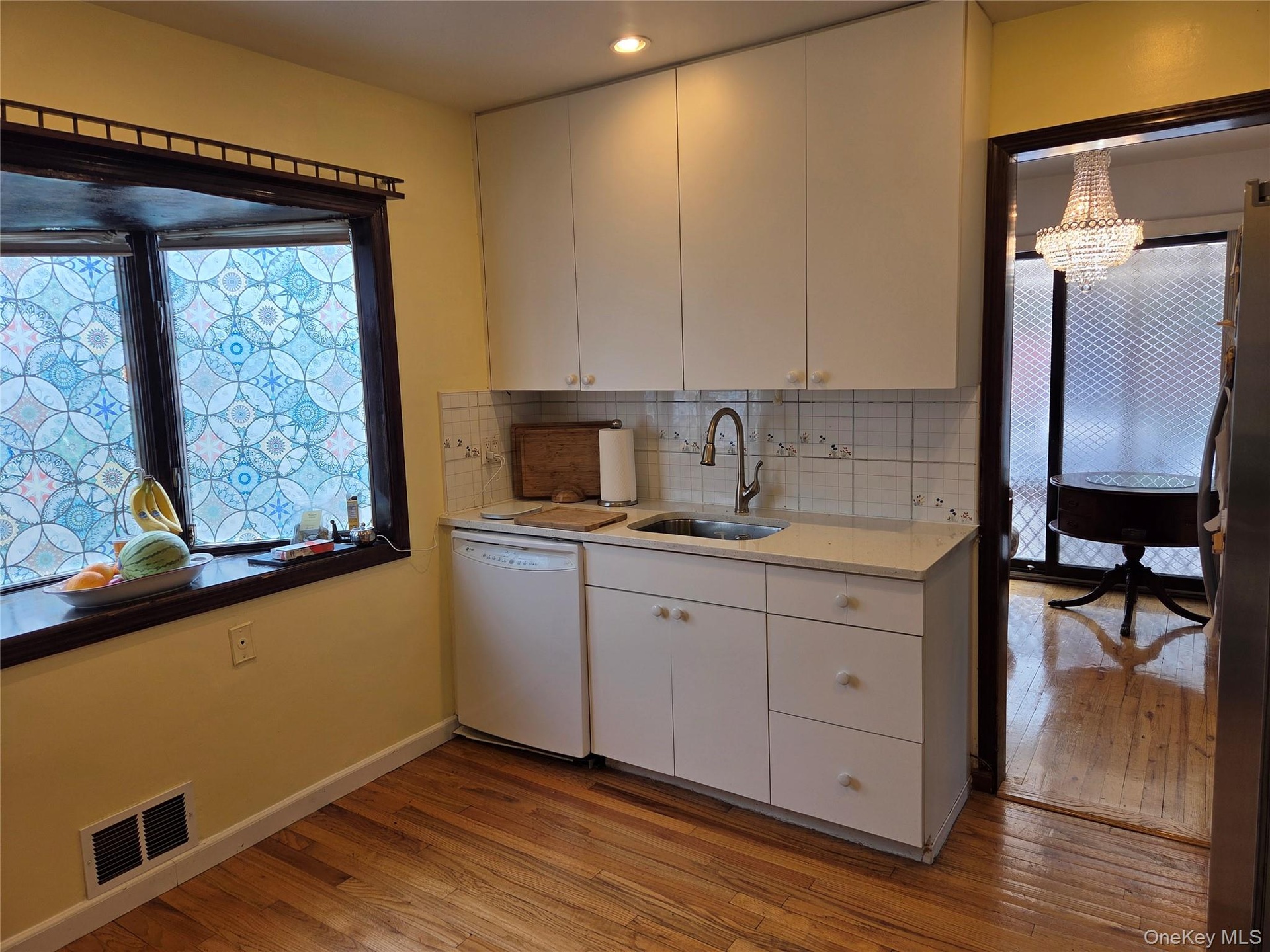 Kitchen facing south with bay window.