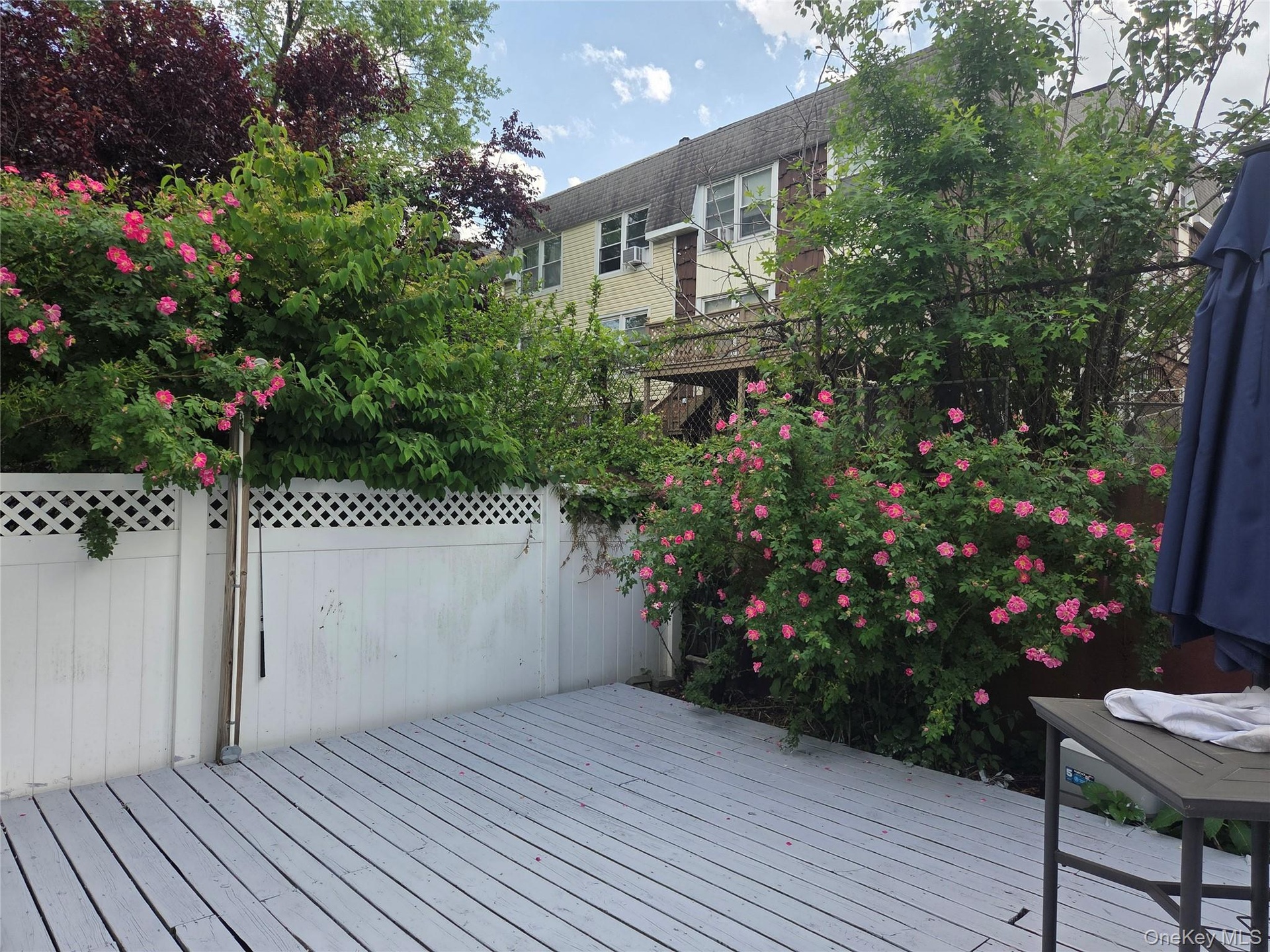 Spacious Back Deck with garden access..
