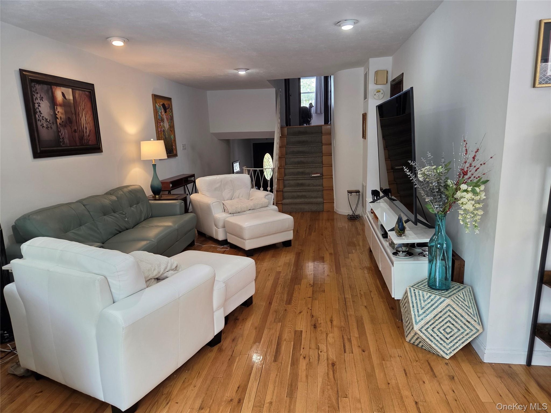 Spacious Living Room with BEAUTIFUL Wood Floors.