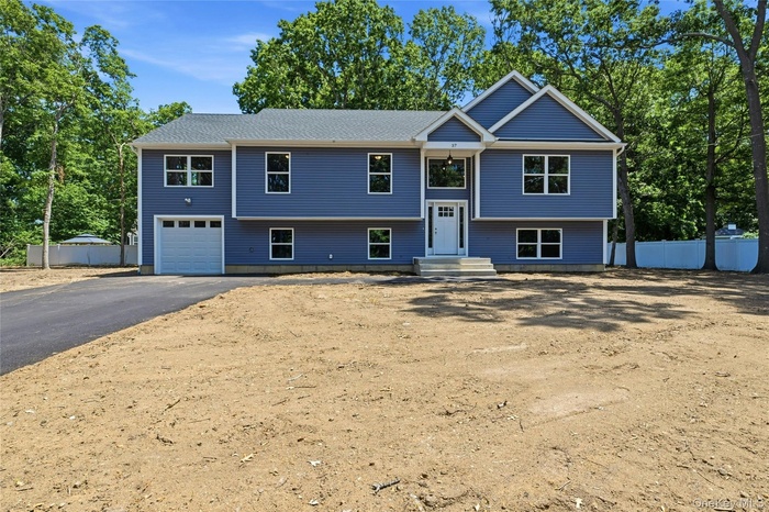 Brand new Raised Ranch just under 3,000 square feet of beautifully designed living space, set on a spacious half-acre  lot on a newly developed road.