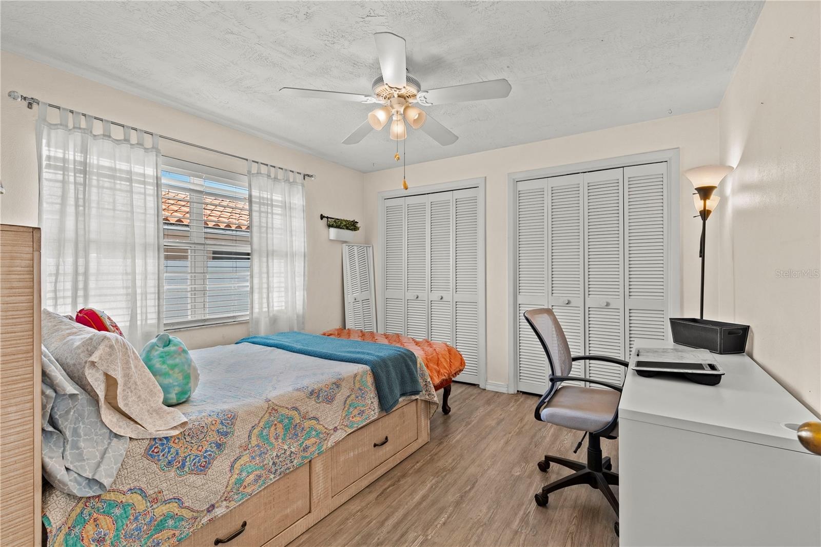 Comfortable and spacious third bedroom featuring ample natural light, generous closet space, and flexibility to accommodate family, guests, or a home 