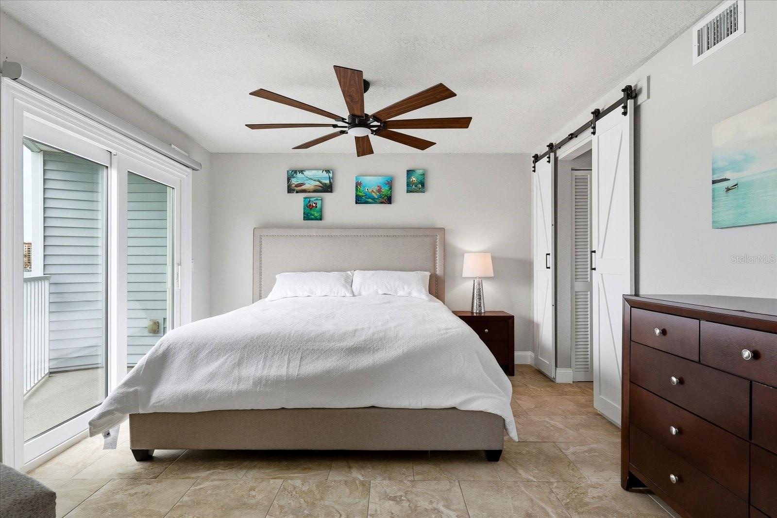 Primary bedroom with private balcony