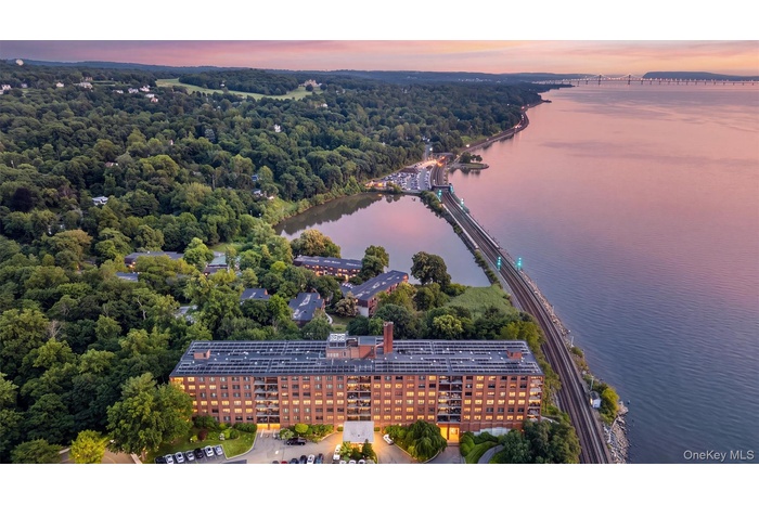 Aerial view toward the Mario Cuomo Bridge along the Hudson River of Scarborough Manor Coop Complex in Ossining, NY.