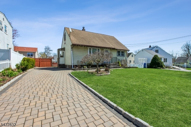 Front With Paved Driveway