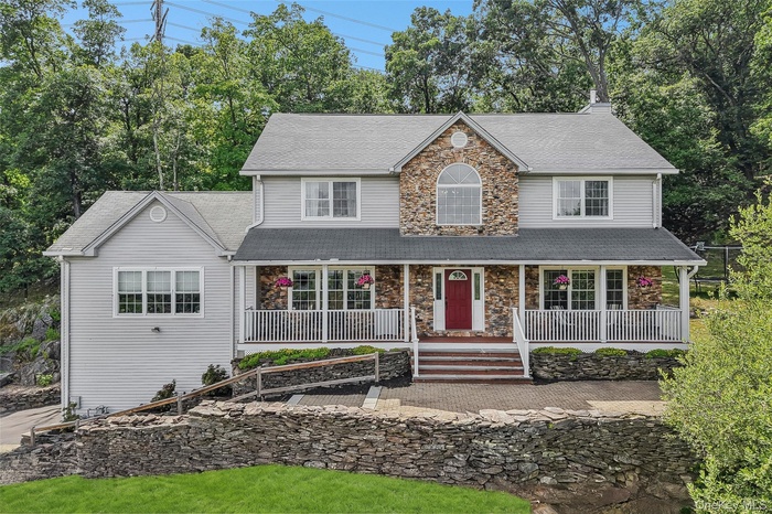 Welcoming porch, stone front