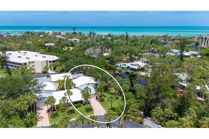 239 Hourglass Way is nestled in a peaceful, private setting overlooking the lagoon that runs through Whispering Sands.