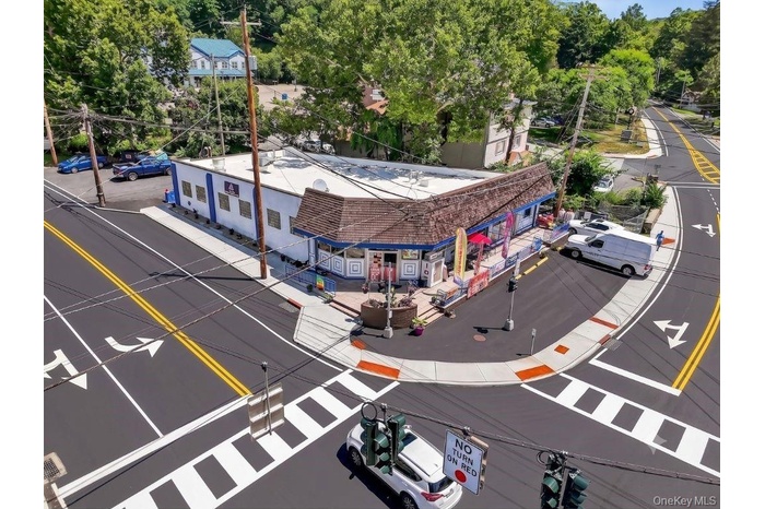 Turnkey town-center commercial property featuring maximum signage exposure, excellent foot traffic, and rare dedicated parking.
