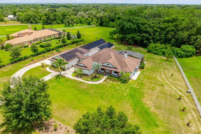 Set on 2.32 PICTURESQUE ACRES inside the GATED ~ EQUESTRIAN COMMUNITY of Beauclair Ranch Club, this CUSTOM BUILT ~ 6-bedroom / 4-bath ~ POOL HOME with