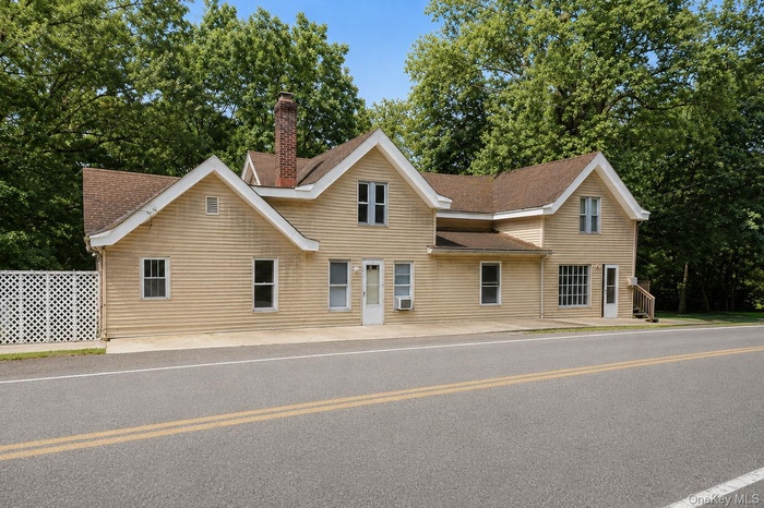 Exterior facade featuring horizontal siding and multiple gables