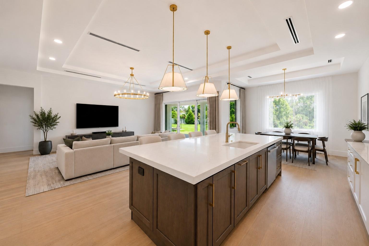 Virtually staged.The gourmet kitchen is a true showpiece, featuring full-height custom cabinetry, an oversized 11-foot quartz island with storage on b