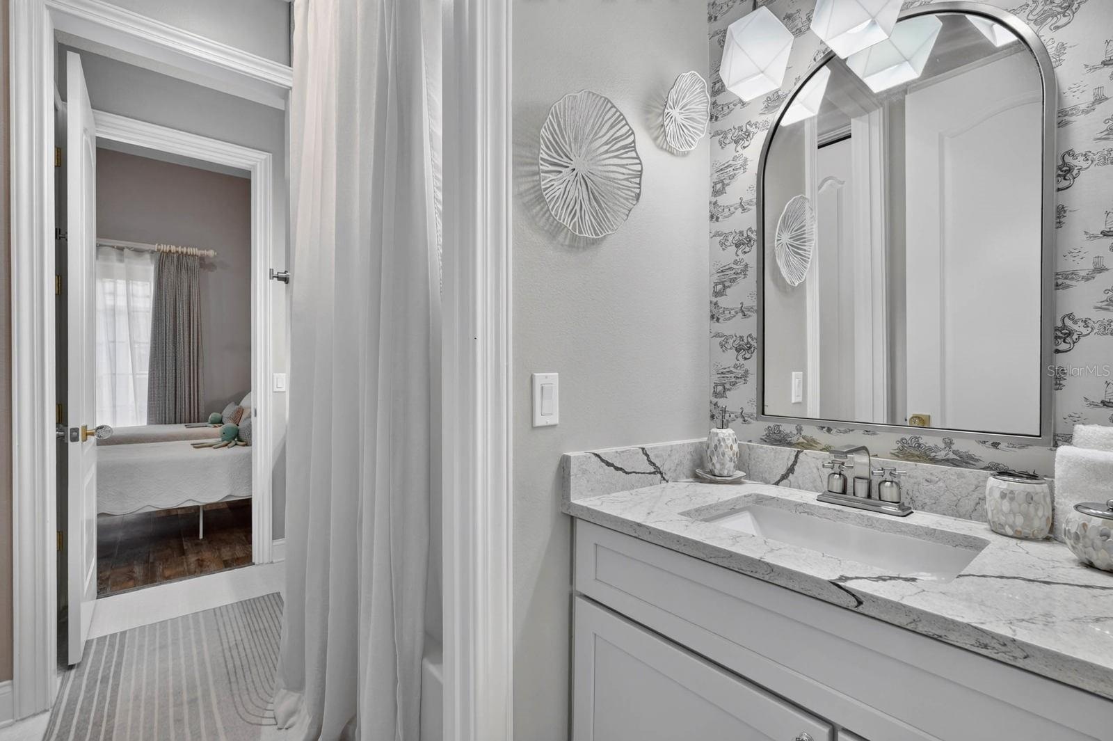 Jack and Jill bath between two downstairs guest rooms